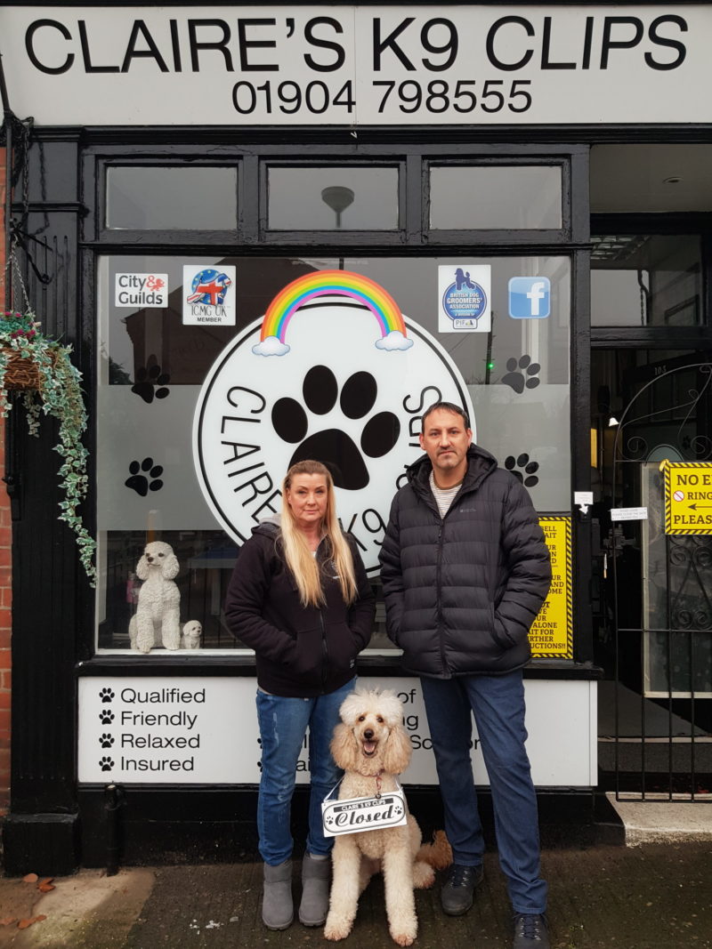 Mr and Mrs Wood standing outside their business